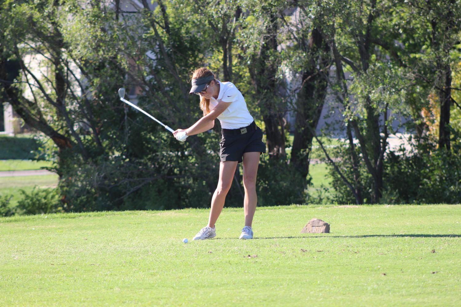 Junior Emma Johnson about to hit the ball on the  sixth hole 