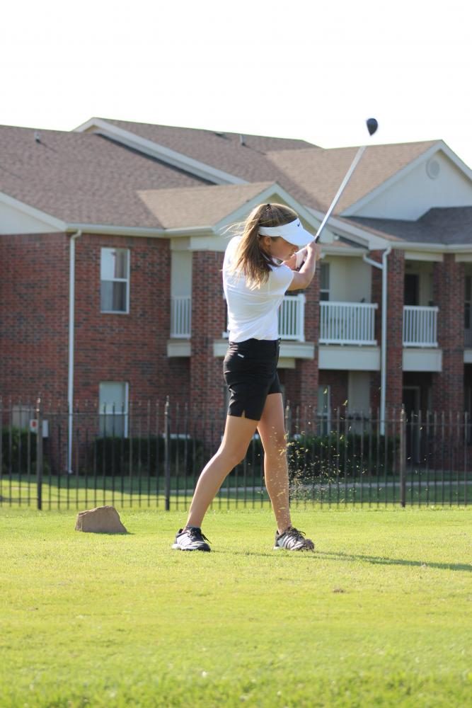 Allison Keasey mid swing at a JV golf tournament 