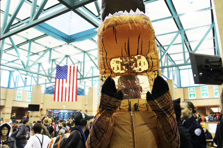 Sophomore Porter Welch poses in his dinosaur costume.