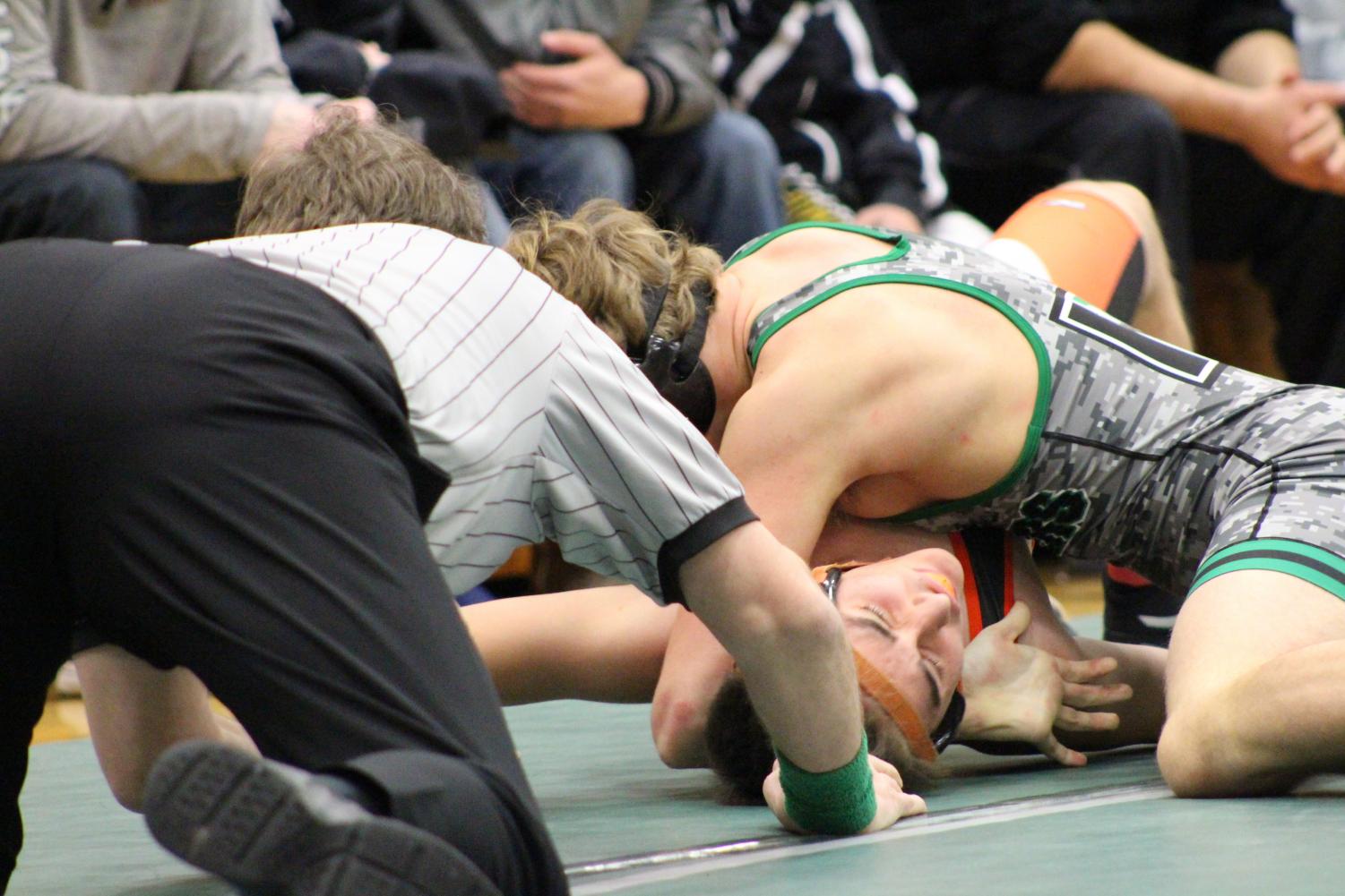 One coach crouches down and counts back from three to end the match at the Derby invitational. Photo by Starla Batemon