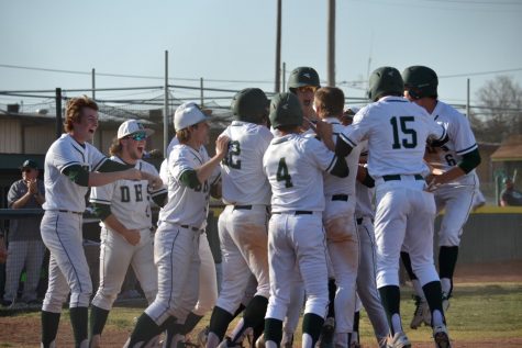 The team celebrating after the walk-off grand slam from Coleson Syring that won the game 10-8.