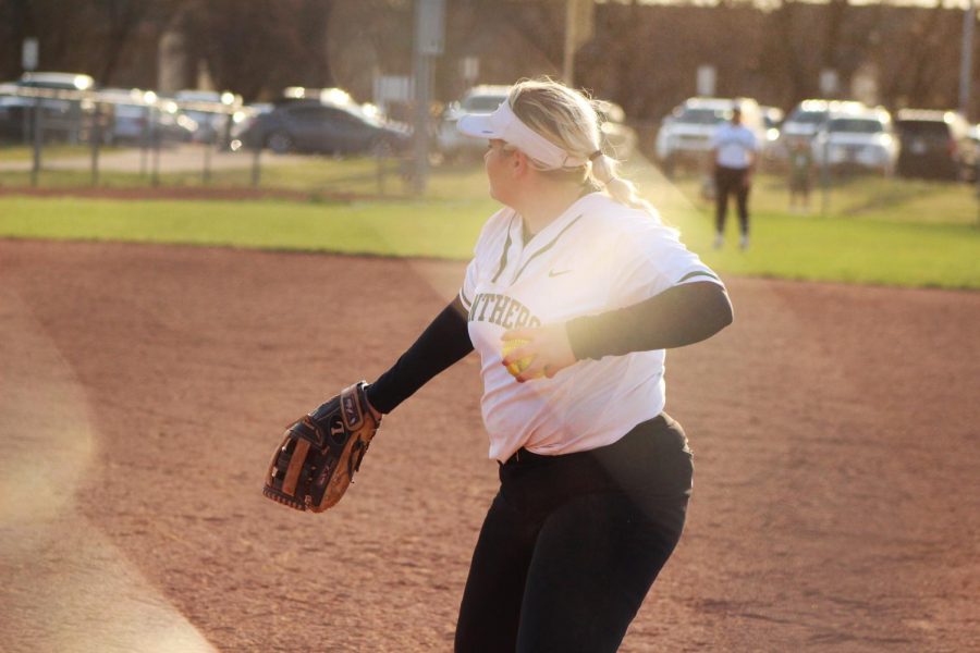 Senior+Kiya+McManus+throws+the+ball+after+striking+out+an+opponent.+The+infield+throws+the+ball+in+a+specific+path+after+every+strikeout+in+order+to+fill+time+between+hitters.