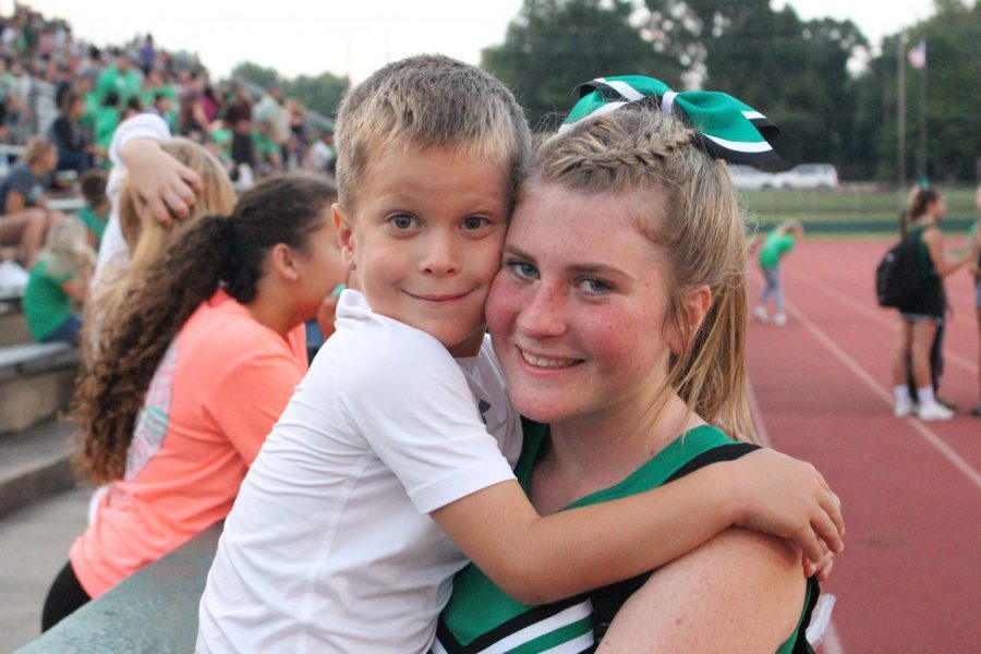 Sophomore Alexus Gashler poses for the camera with her little brother.