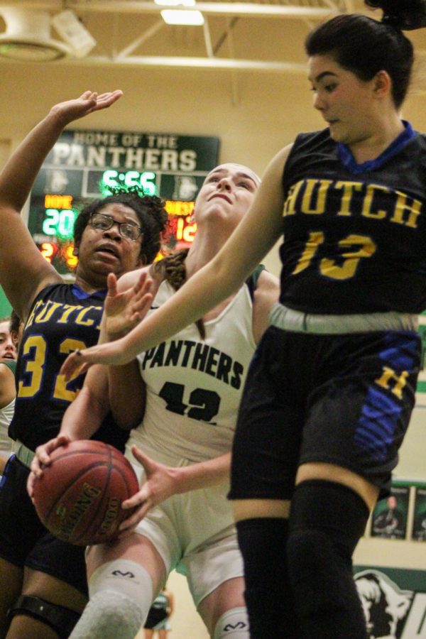Senior Kennedy Brown moves through Hutchinsons defense for a layup. The Panthers defeated the Salthawks 63-30.