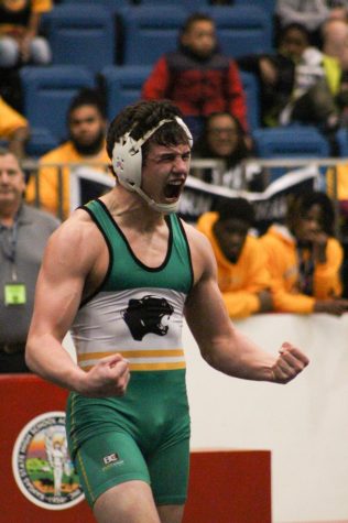 Senior Triston Wills celebrating after winning the Class 6A 182 pound championship. Wills is a back-to-back state champion.