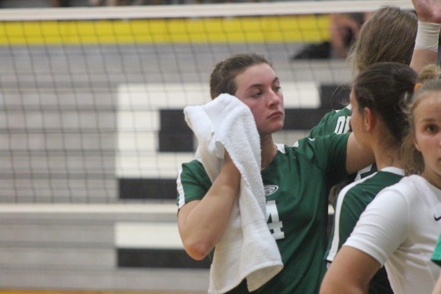 Junior+Sophie+Connor+wipes+her+face+while+gathering+for+a+huddle