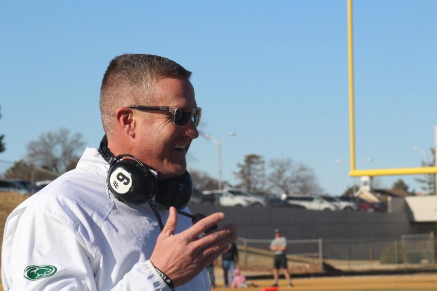 Coach Brandon Clark smiles after a touchdown