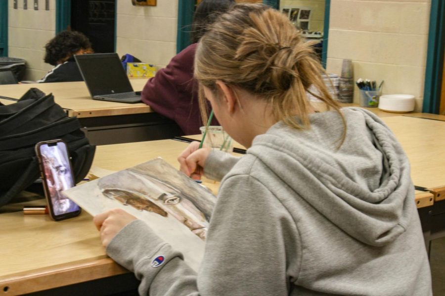 Students doing work (photos by Poy Nopphavong)