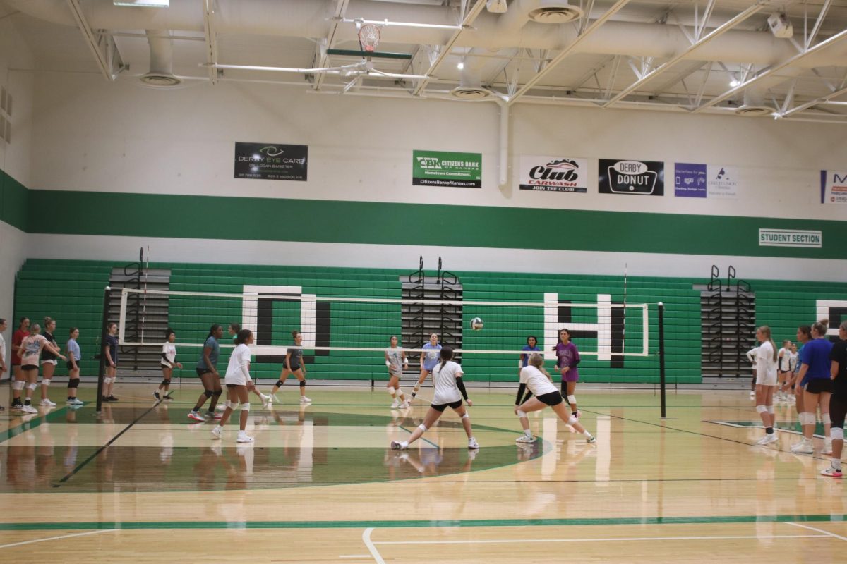 Volleyball players train at practice. 