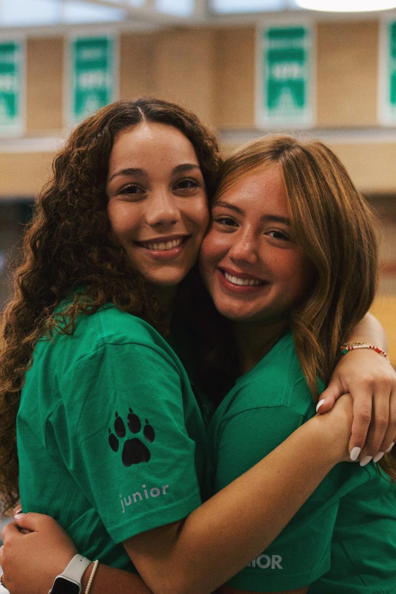 Camryn Gonzalez and Lillian Like hug in-between class periods. 