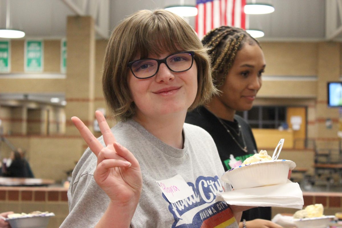 Student poses with icecream at stuco retreat