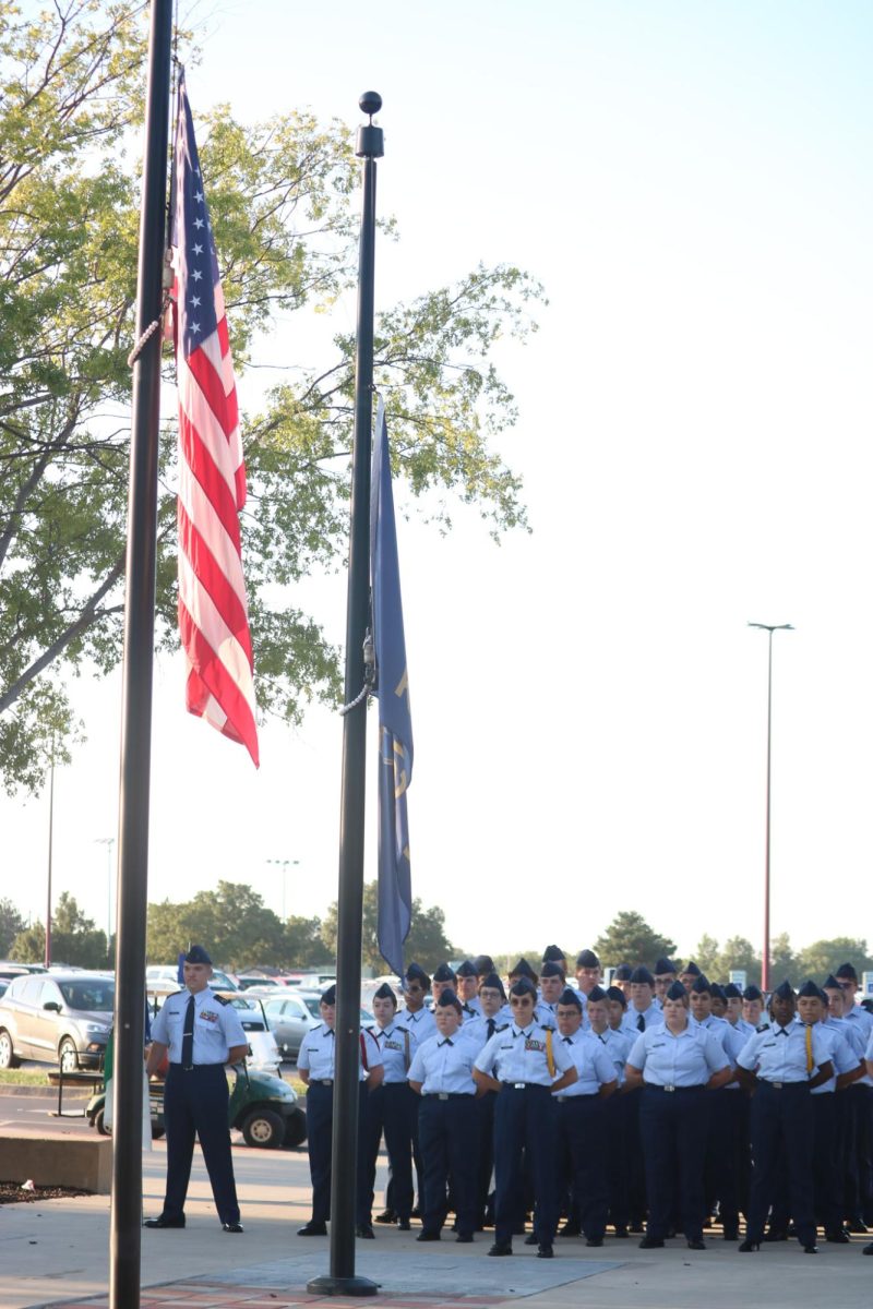 AFJROTC Cadets stand in position during ceremony.