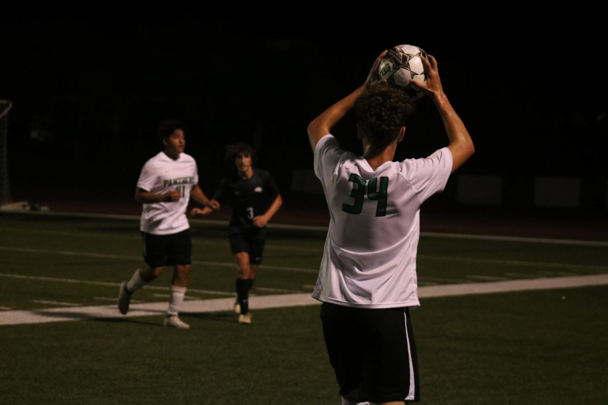 Player gets ready to toss the ball to a teammate.