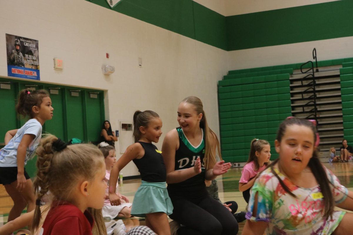 Junior Carly Berglind talking to one of the kids.