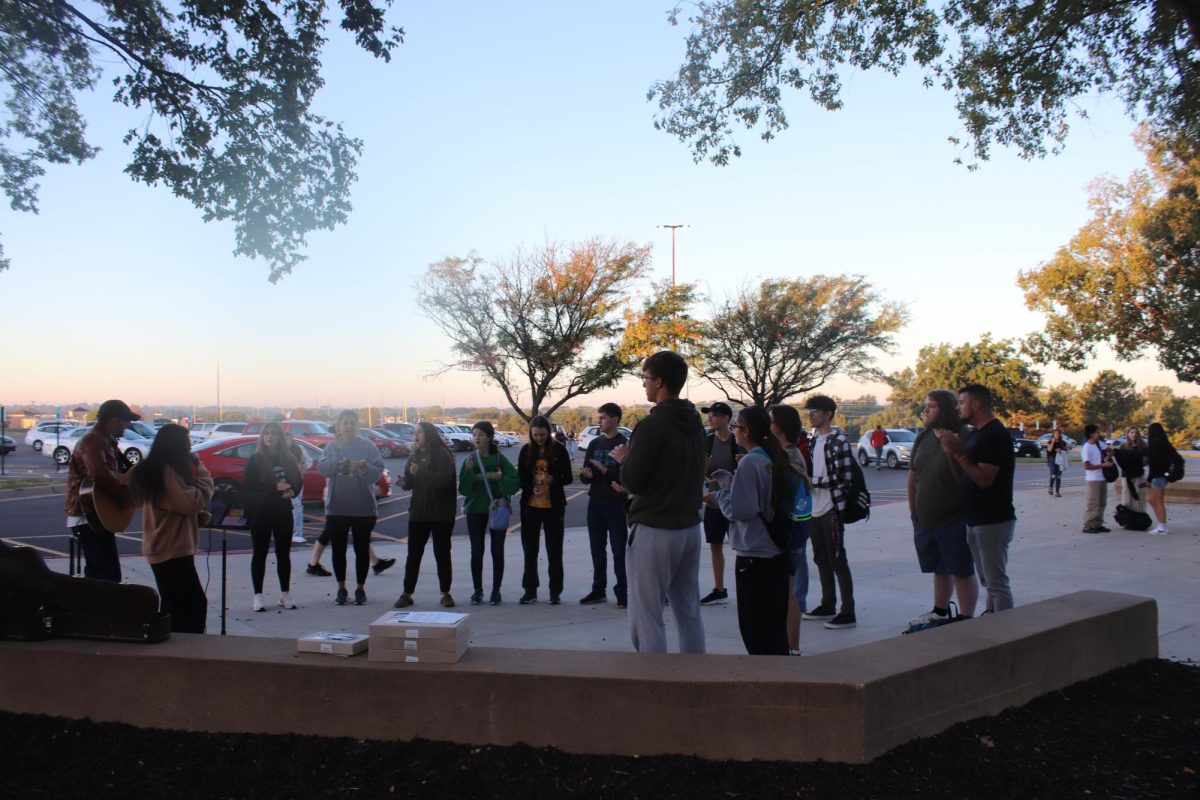 Students sing the songs.