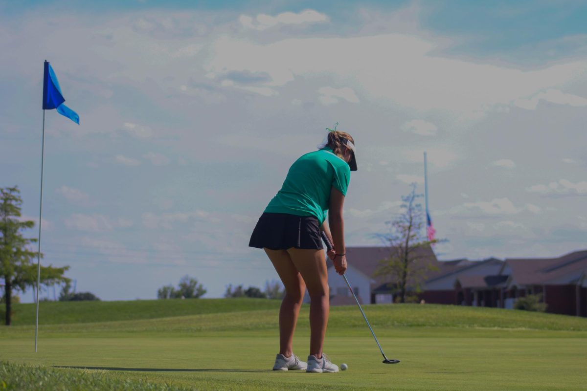 Senior Austyn Teufel prepares to swing to hit the ball.