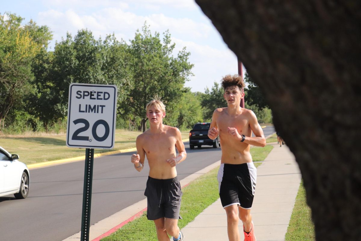 Cross Country Runners stick together through the last strides of their workouts.