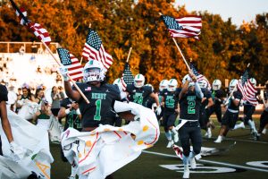 Football player runs with flags