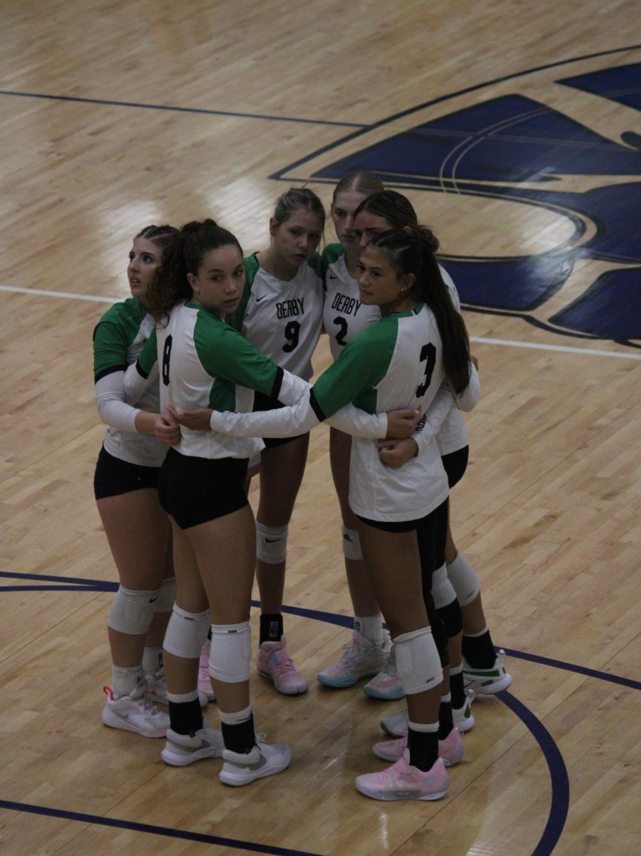 The starters huddle up before the game begins.