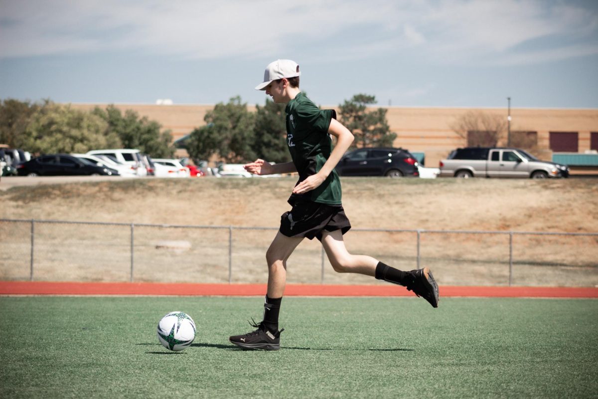 Sophomore Cole Davis runs for the ball.