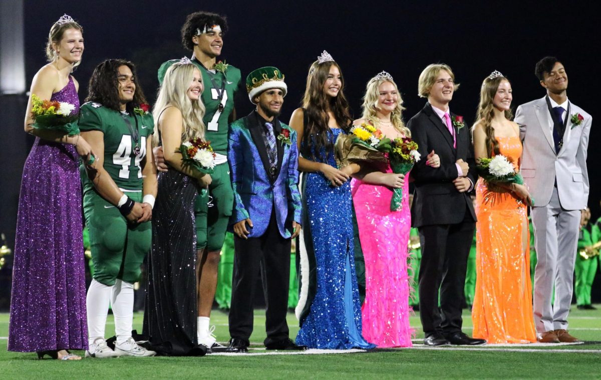 Seniors Boston Dunn and Mallory Baker are crowned as this year's homecoming King and Queen after the varsity football team's 49-6 victory against Valley Center at the homecoming game. The Marching band performs their show after Derby’s 49-6 victory.