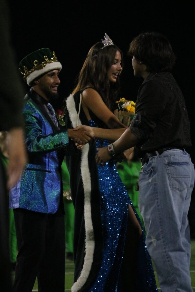  Senior Boston Dunn puts on Homecoming Kings crown.