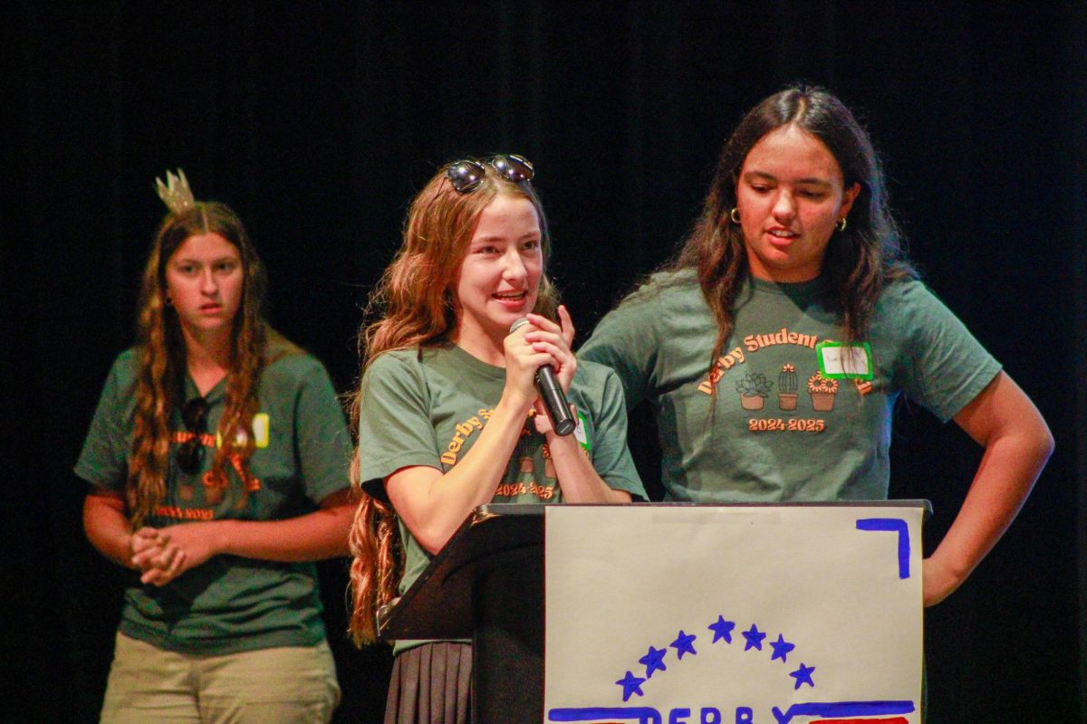 Welcoming the crowd, senior Ellison Beran gives a warm welcome.