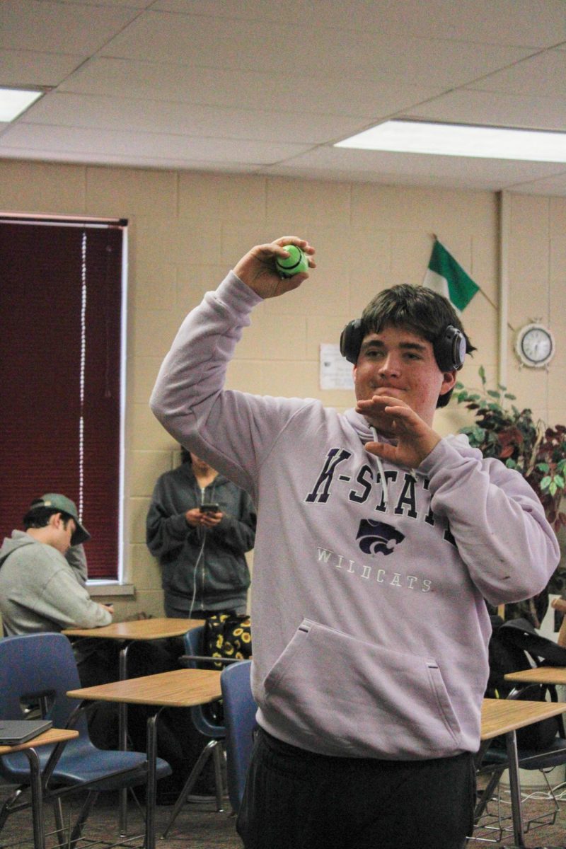 Junior Quinlan Egan throws a miniature football.