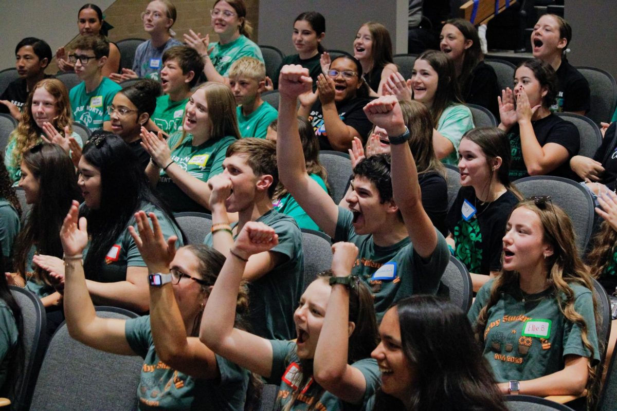 Student Council members shout and cheer.