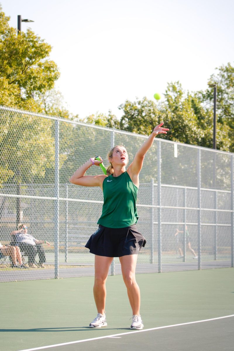 Senior Loren Sweat serves the ball to the opposing team.