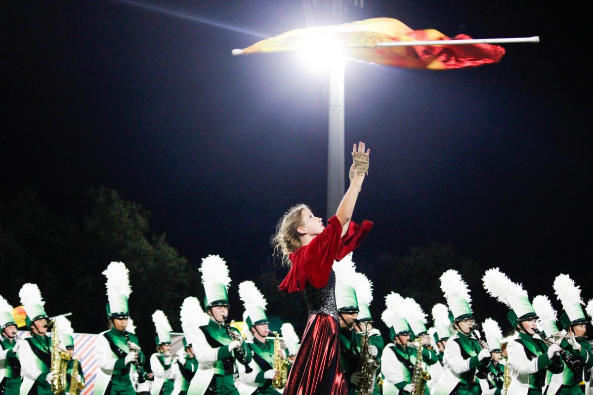 Flag girl flips flag in the air 