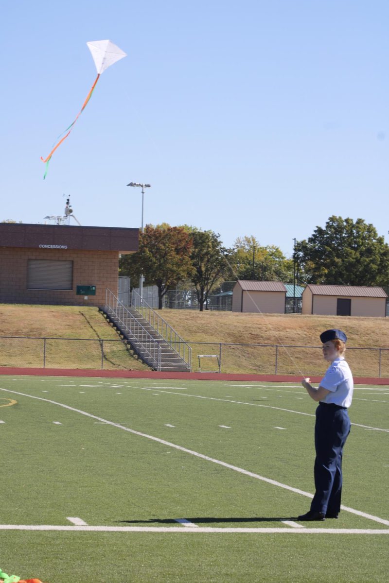 AFJROTC member brings back kite. 