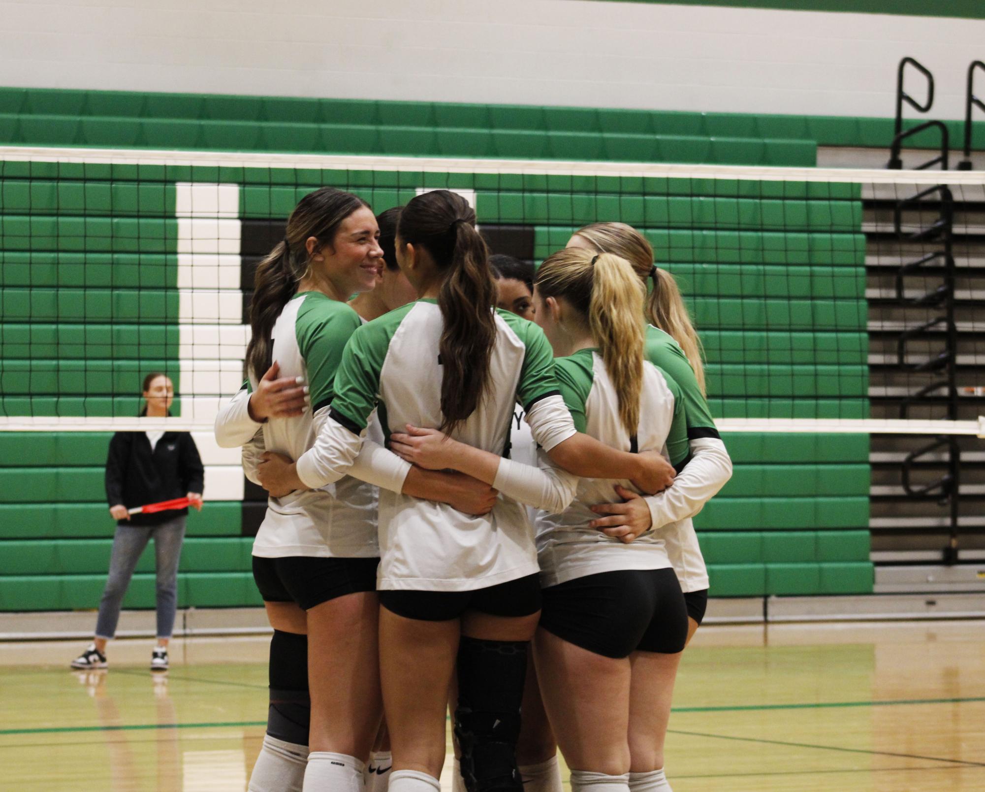 Varsity volleyball plays against Ark City at home. 