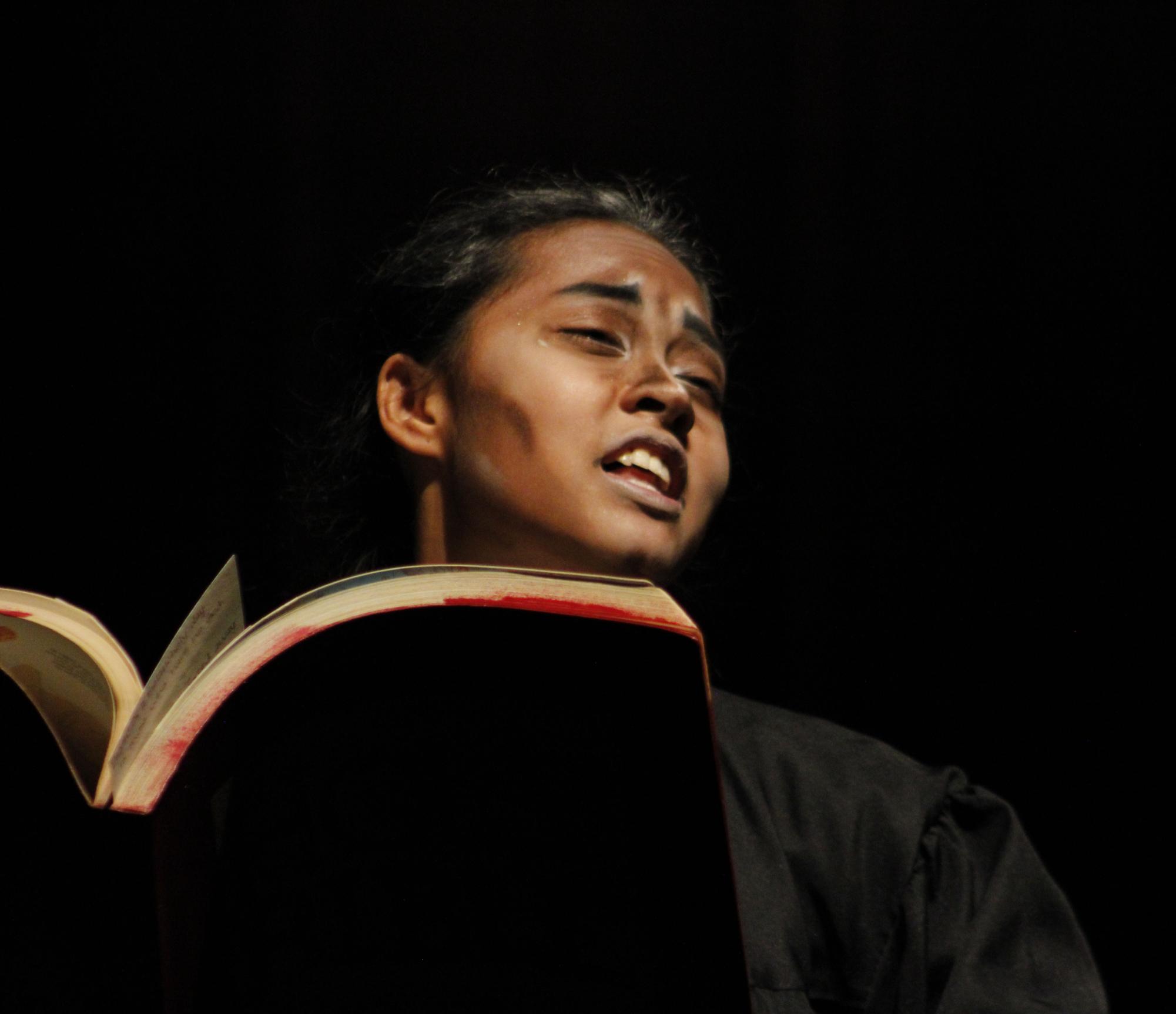 Student acts as preacher during church scene. 