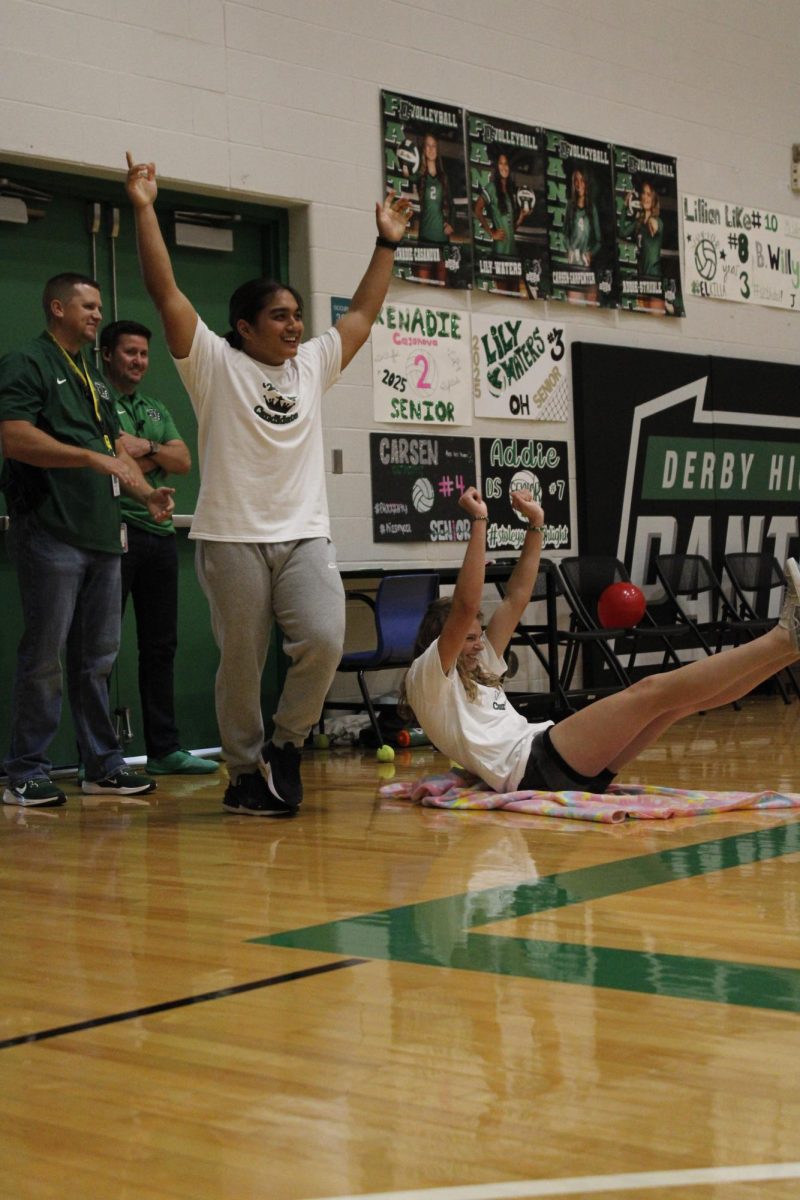 Seniors Kikoa Indalecio and Piper Hula, after winning the race between Homecoming canidates.