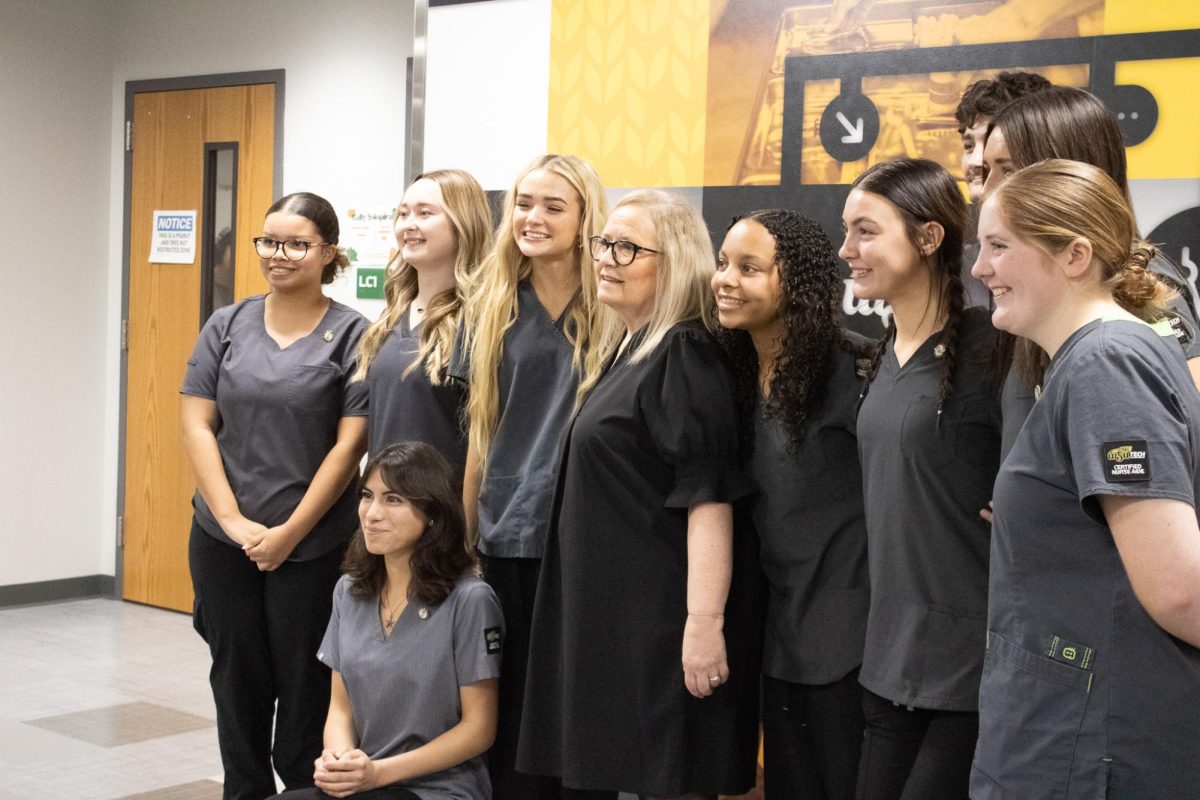 CNA students pose with Mrs. Vicky for a picture.