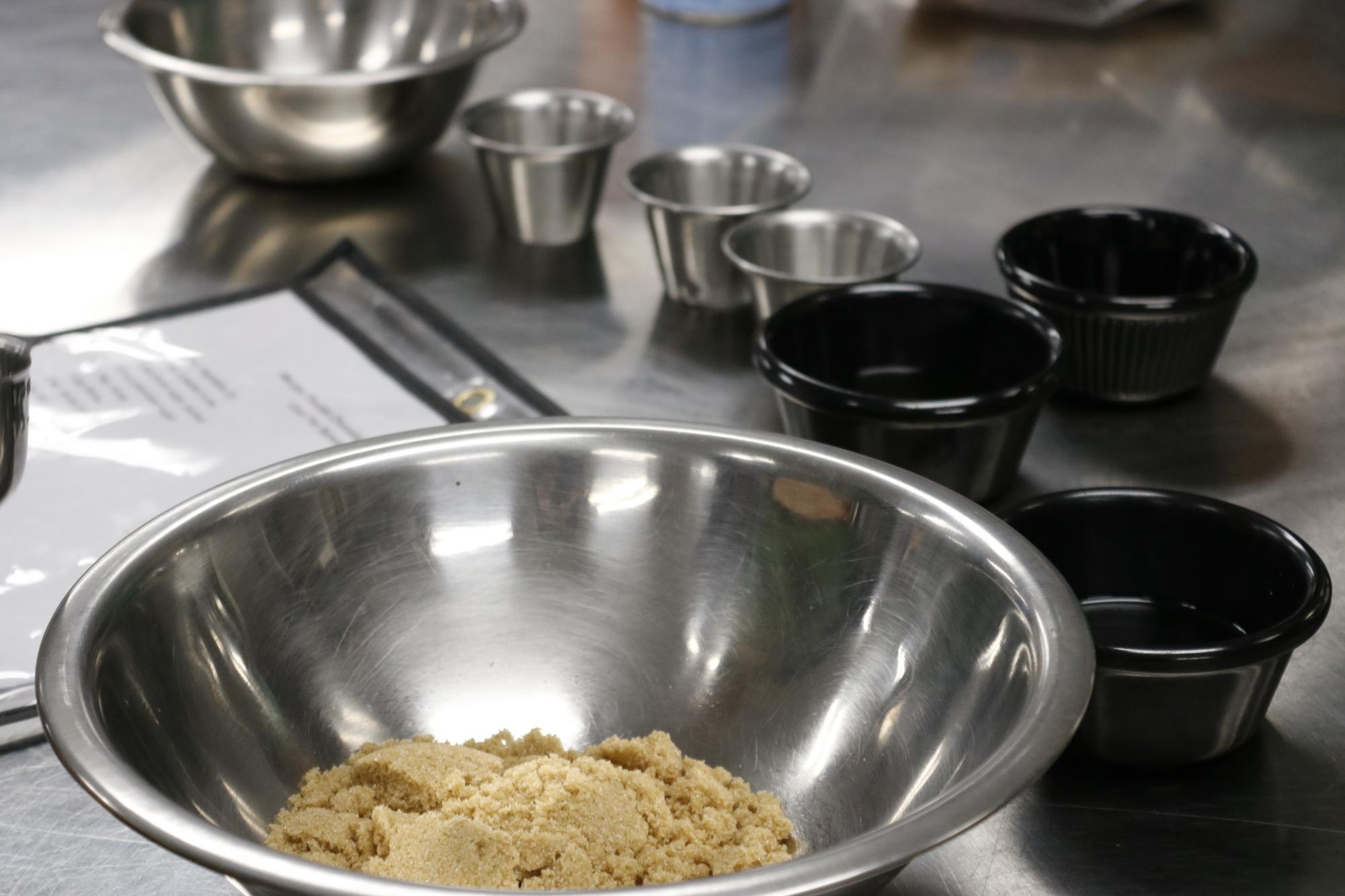 organizing ingredients into bowls.