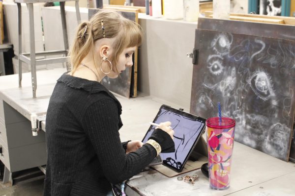 Senior Scarlet Pryde draws on computer.