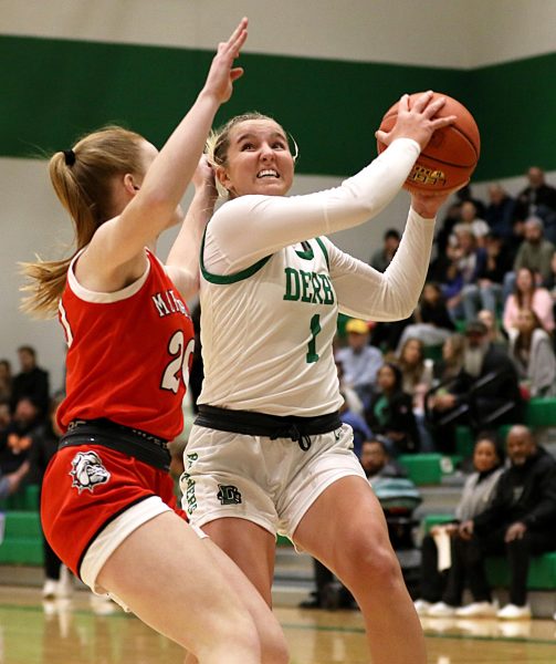 Derby’s girls’ varsity basketball team defeated McPherson 73-32 on Dec. 10, improving their season record to 1-1. The team displayed exceptional teamwork throughout the game.