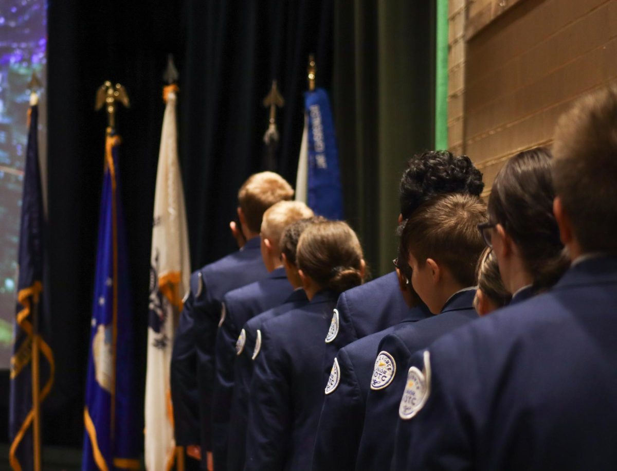 AFJROTC members walks up to the stage. 