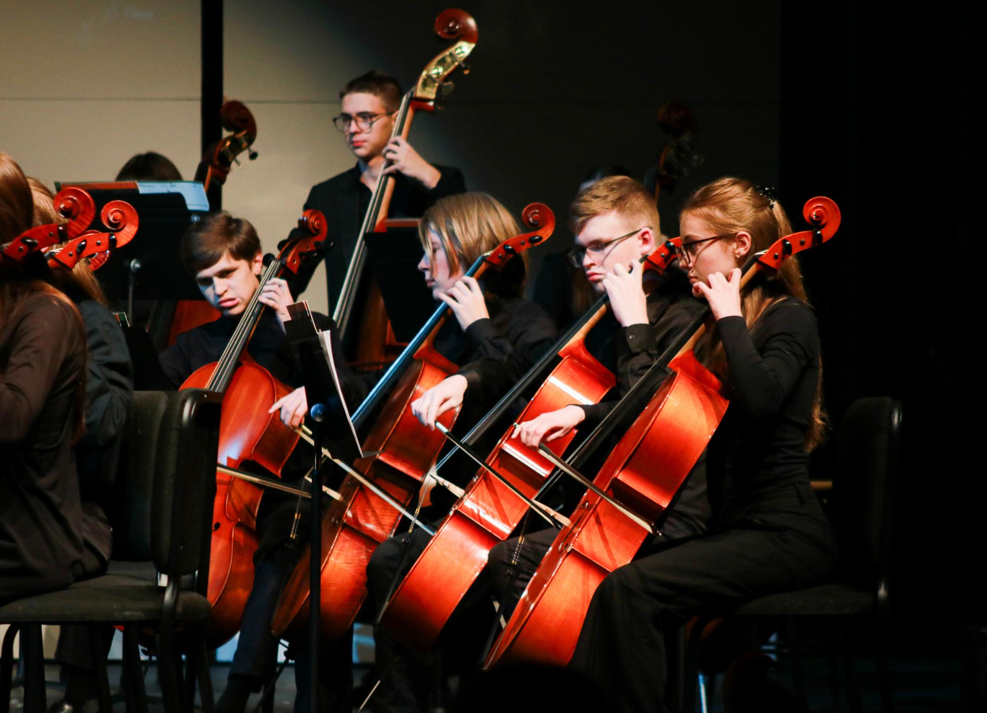 Cello section performs.