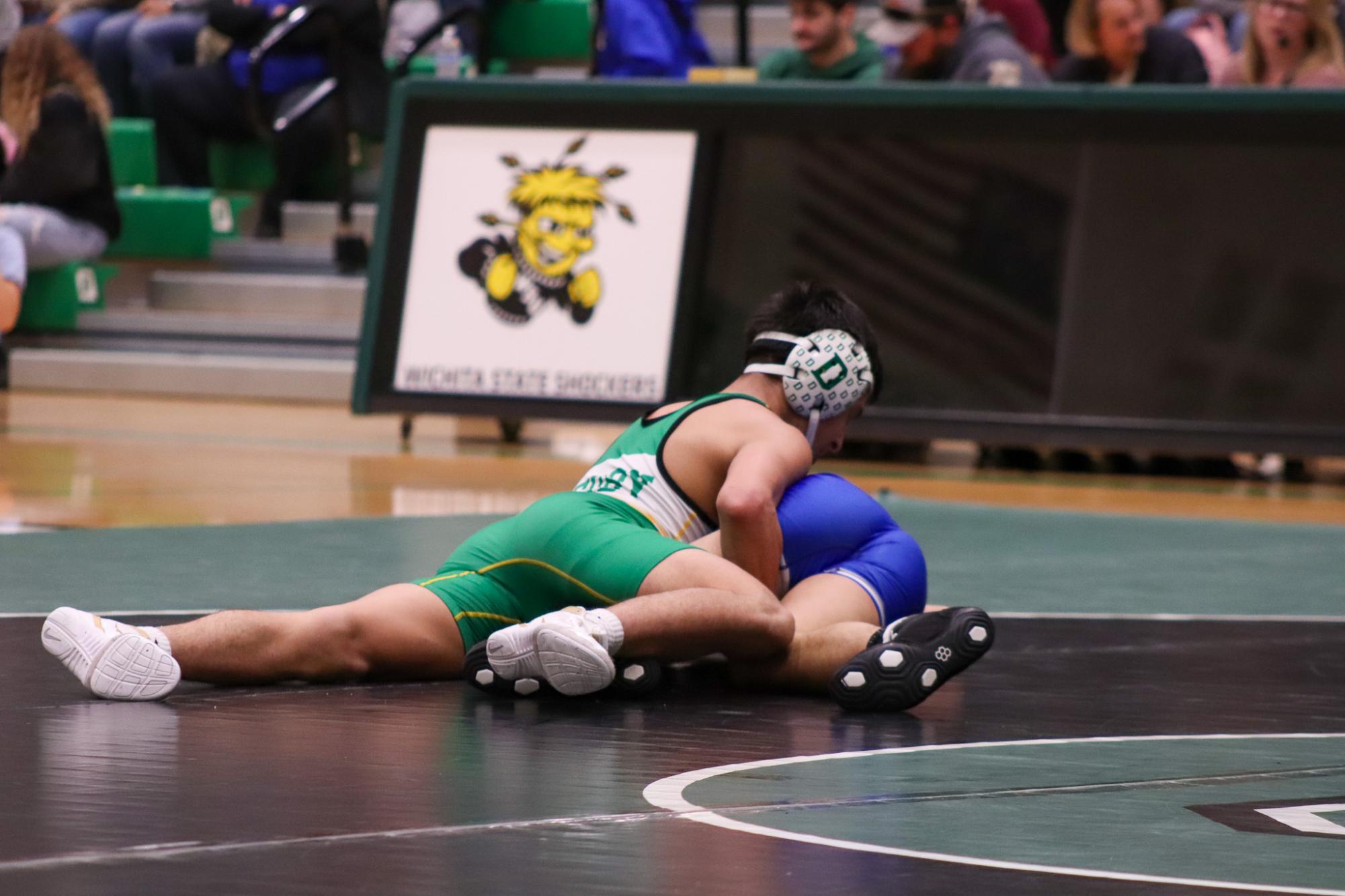 Girls and boys varsity wrestling vs. girls and boys Kapaun (Photos Delainey Stephenson)