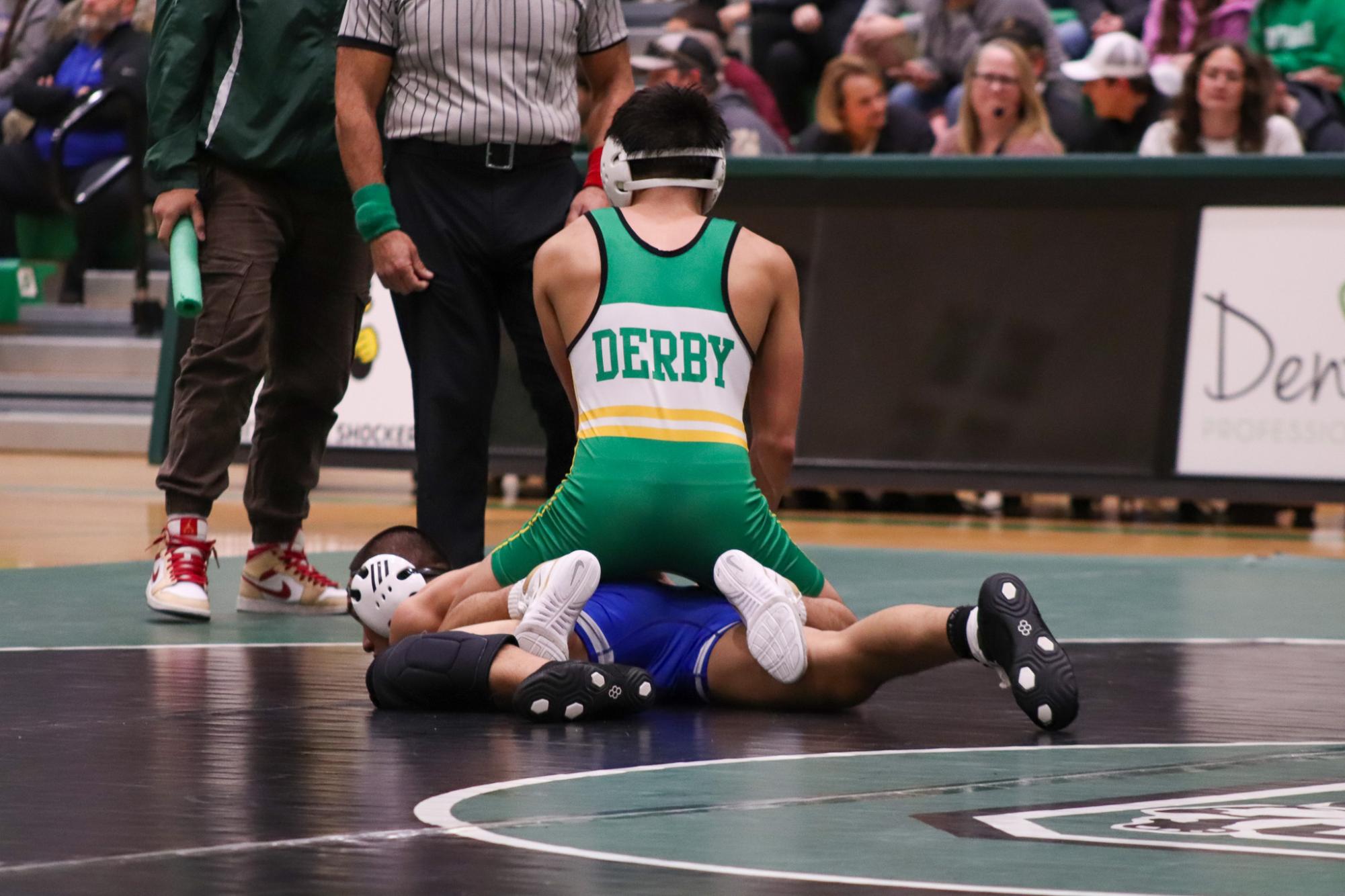 Girls and boys varsity wrestling vs. girls and boys Kapaun (Photos Delainey Stephenson)