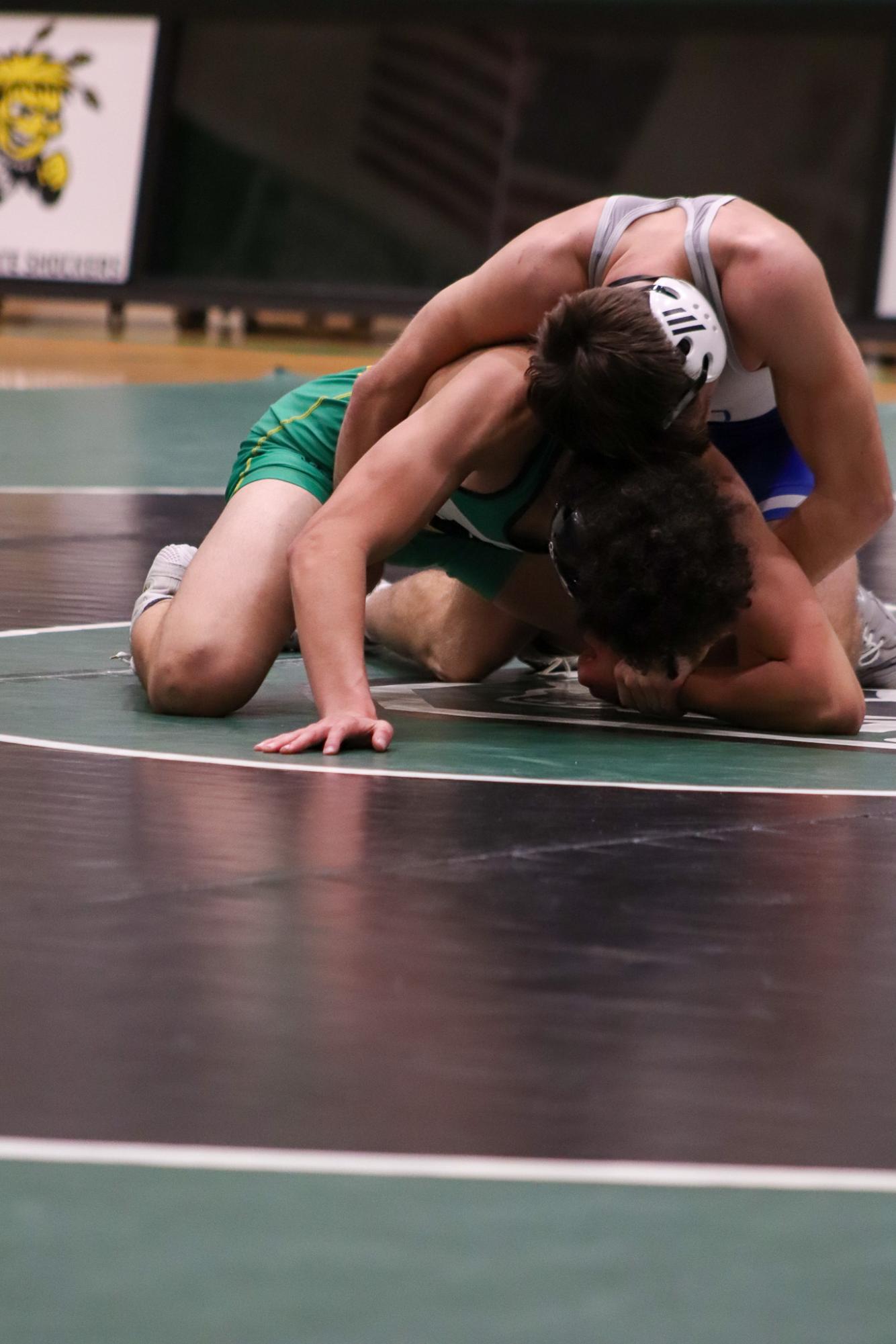 Girls and boys varsity wrestling vs. girls and boys Kapaun (Photos Delainey Stephenson)