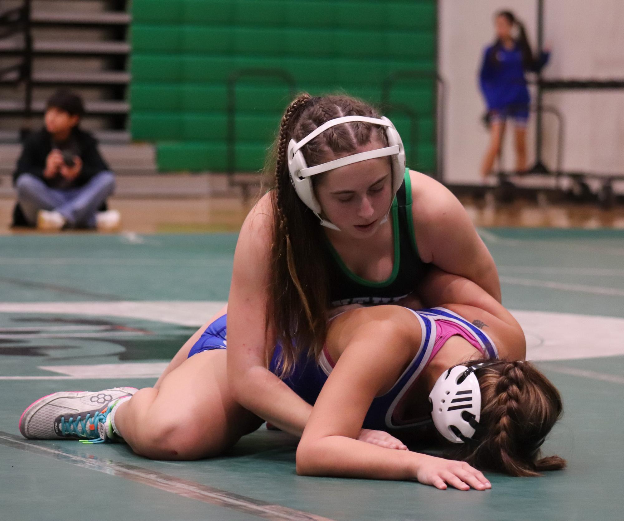 Junior Brook Downs pinning down opponent. 