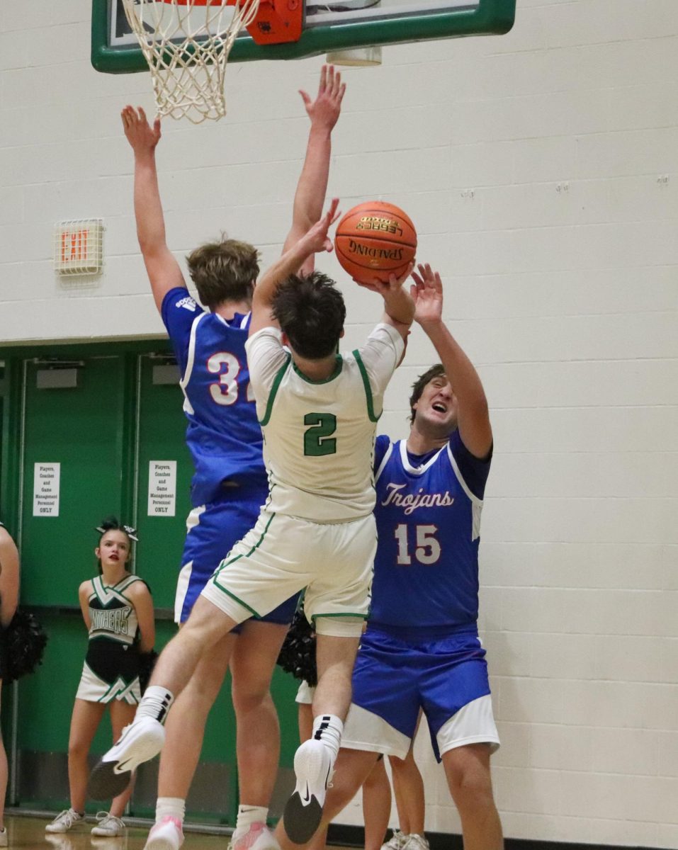 Players shoots for the basket. 