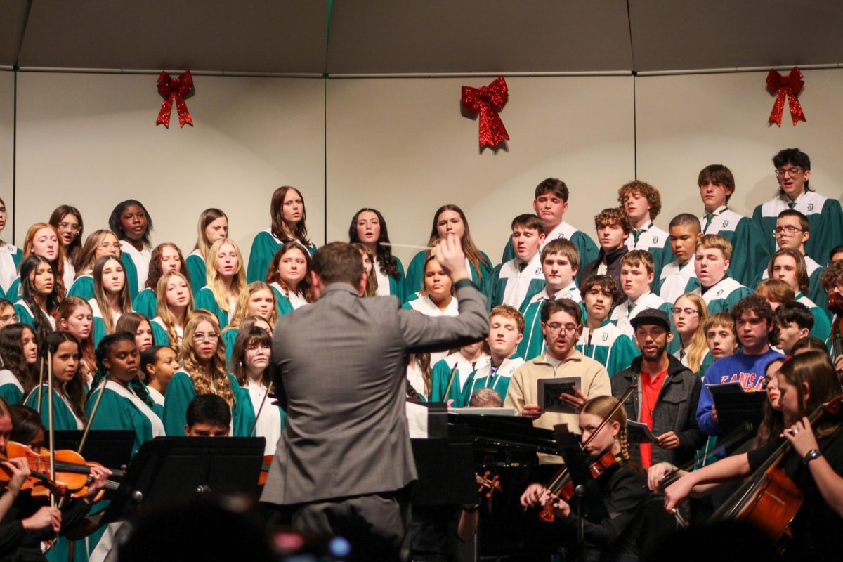 All choirs sing along with Derby High School choir alumni and accompanied by members of the Derby High School Orchestra.