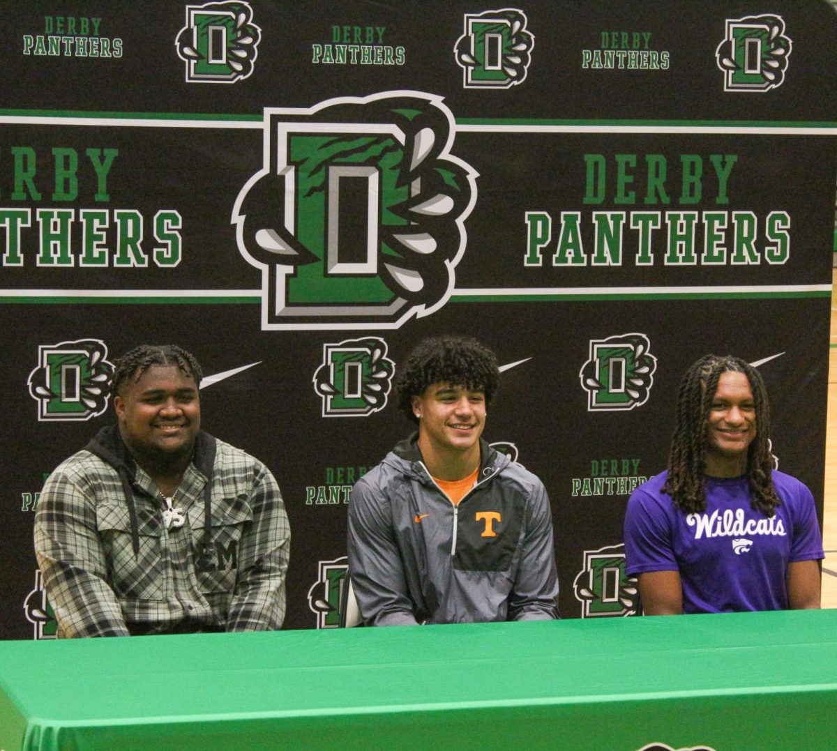 Senior's Milan Colvin, Da'Saahn Brame, and Martel Jackson pose for a photo all together. 