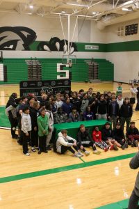 The football team joining their friends in a signing photo. 