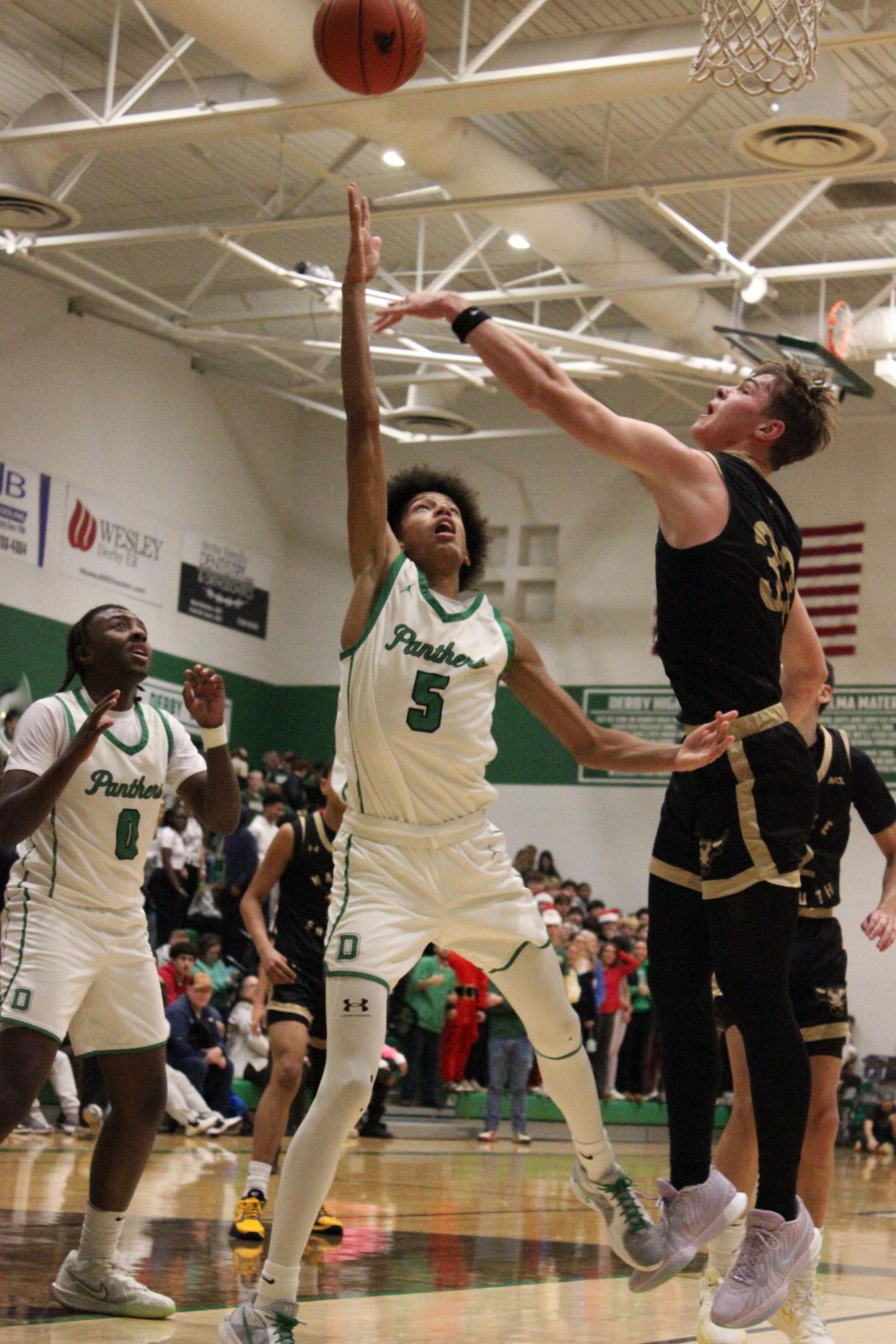 Boys varsity basketball vs. Maize South (Photos by Bree Stuhlsatz)